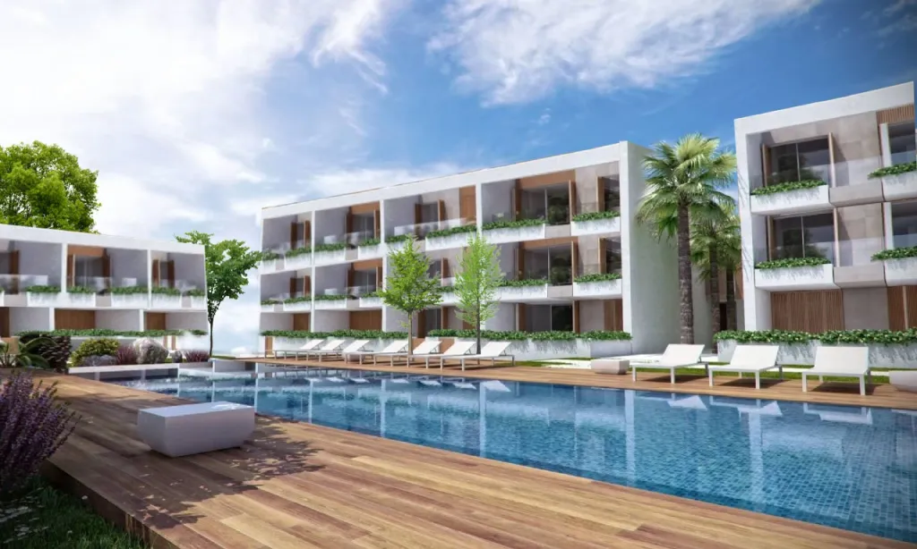 Pool deck and residence building facing the sea